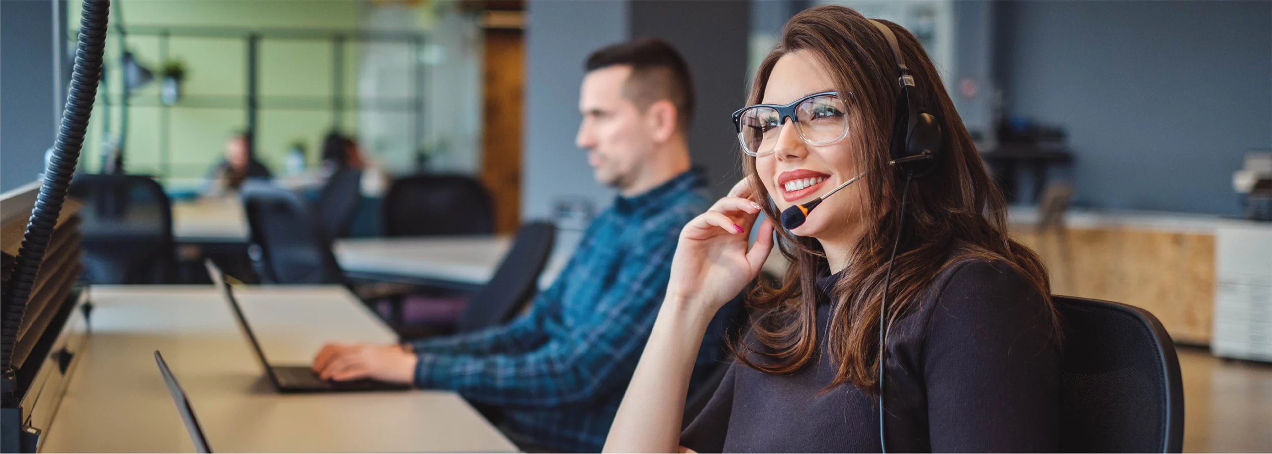 Happy agent working in a call center that offers excellent agent experience