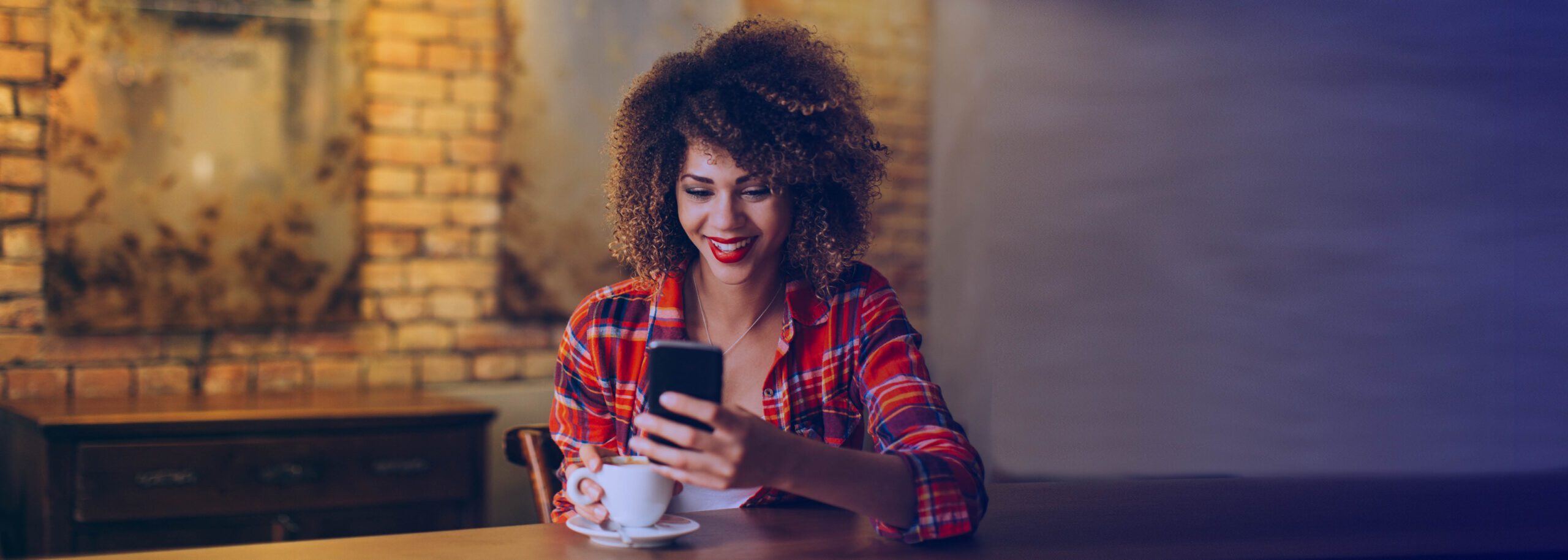 Happy woman delighted with her customer experience on her cell phone