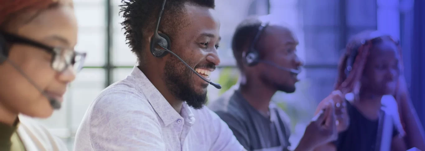 Happy agents in Africa working in a modern call center