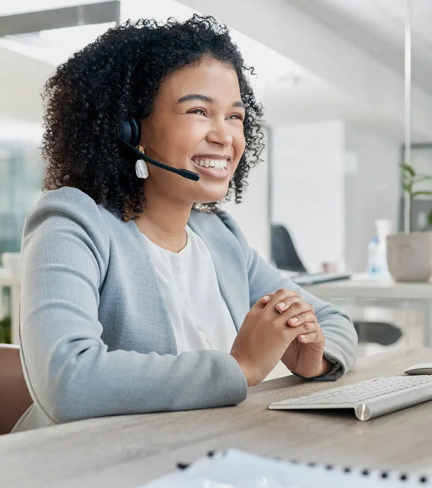 Female agent happy with automated quality management support in a call center