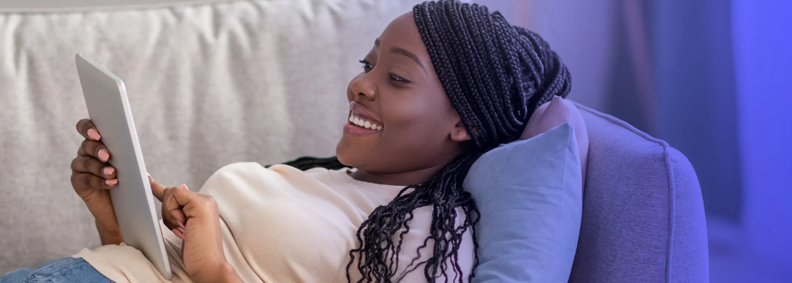 Happy woman browsing an online store through her tablet