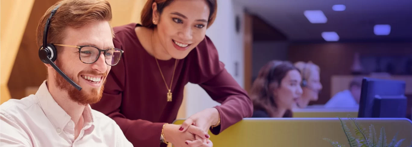 A call center leader coaching the newly hired agent