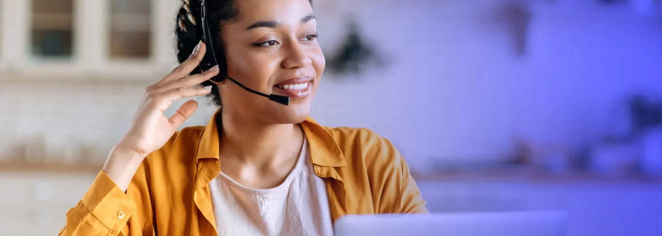 A woman agent using Startek cloud application for customer interaction from the comfort of home