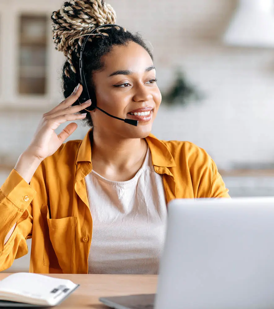 A woman agent using Startek cloud application for customer interaction from the comfort of home