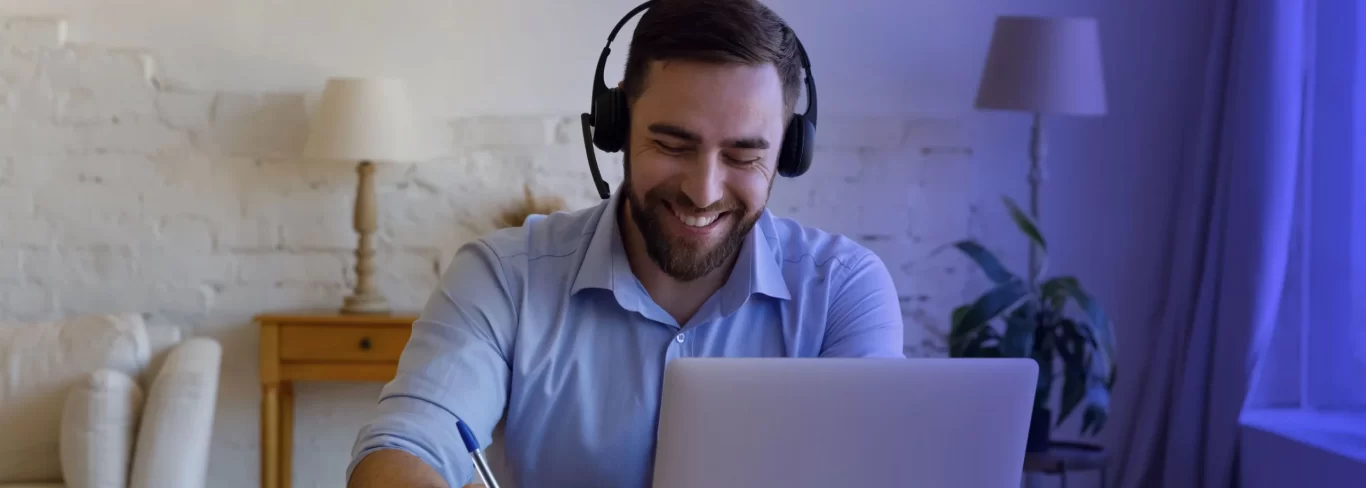 A happy agent speaking with the client from a work from home set up