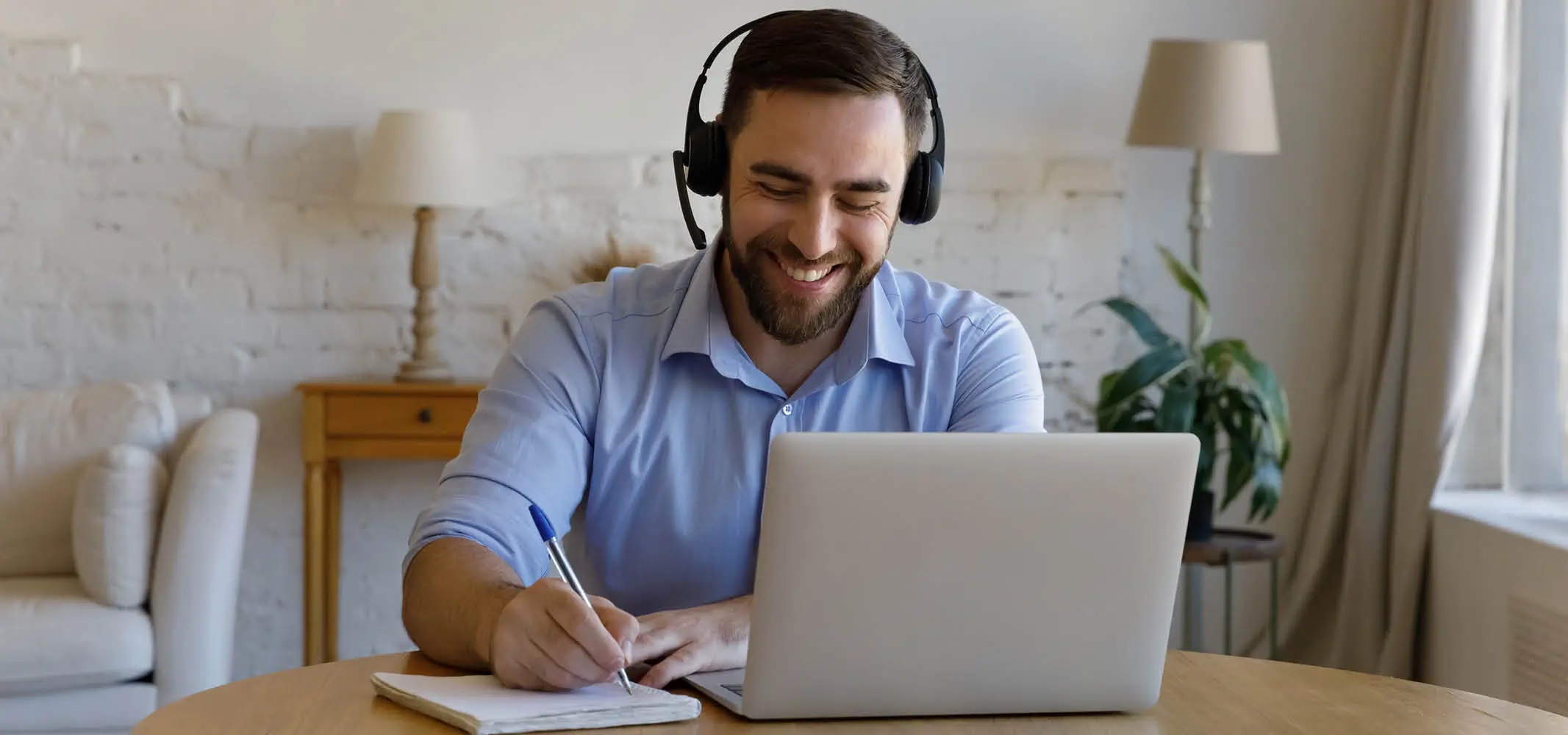 A happy agent speaking with the client from a work from home set up