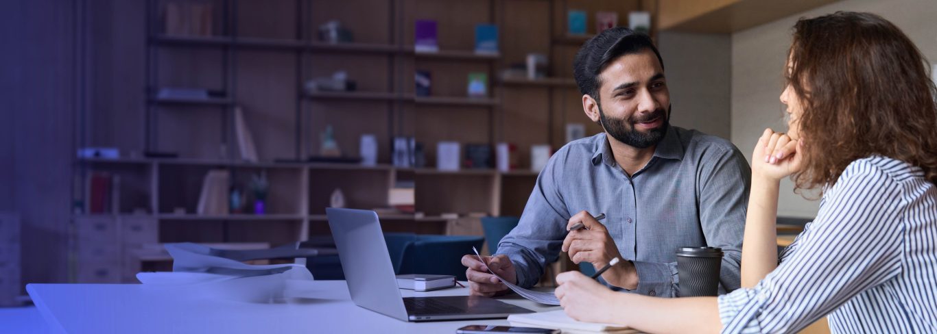 Two happy colleagues at work