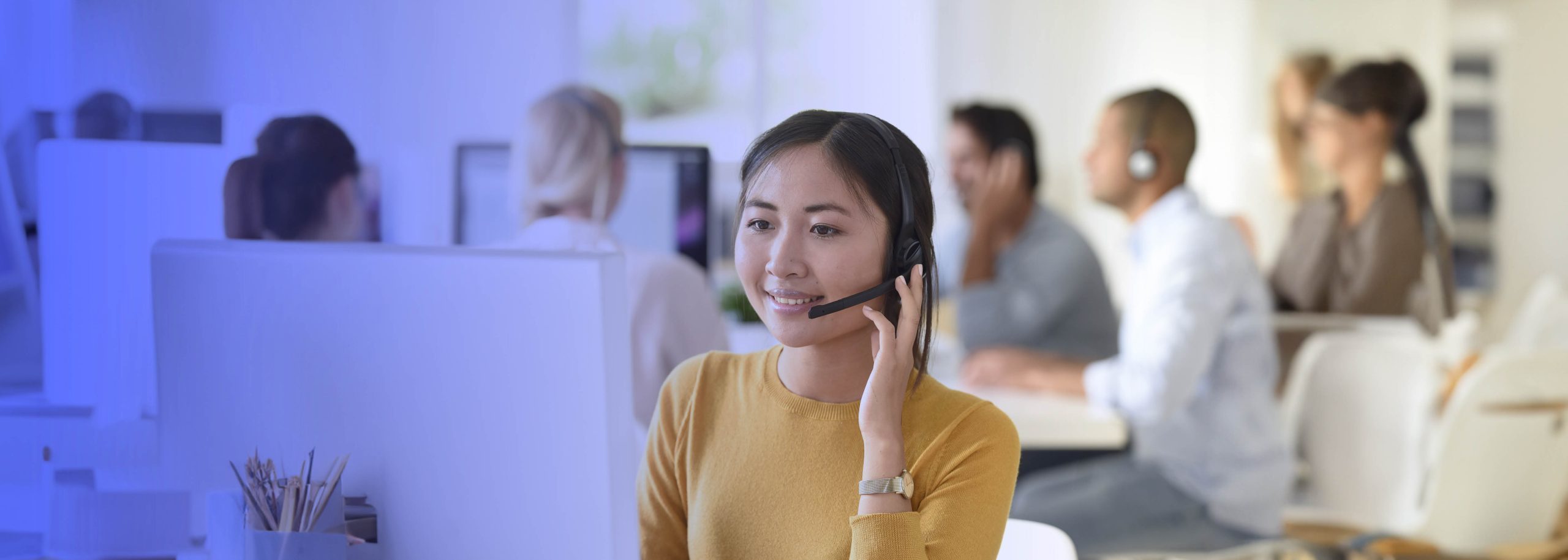 Asian girl attending calls at a contact center