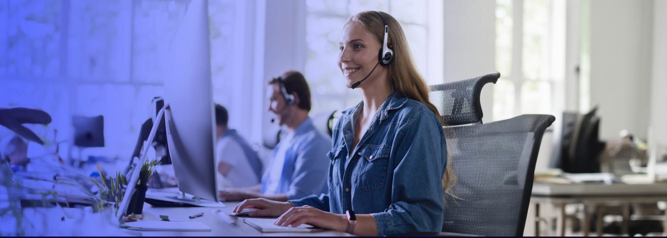 happy call center employee using aqm for her call